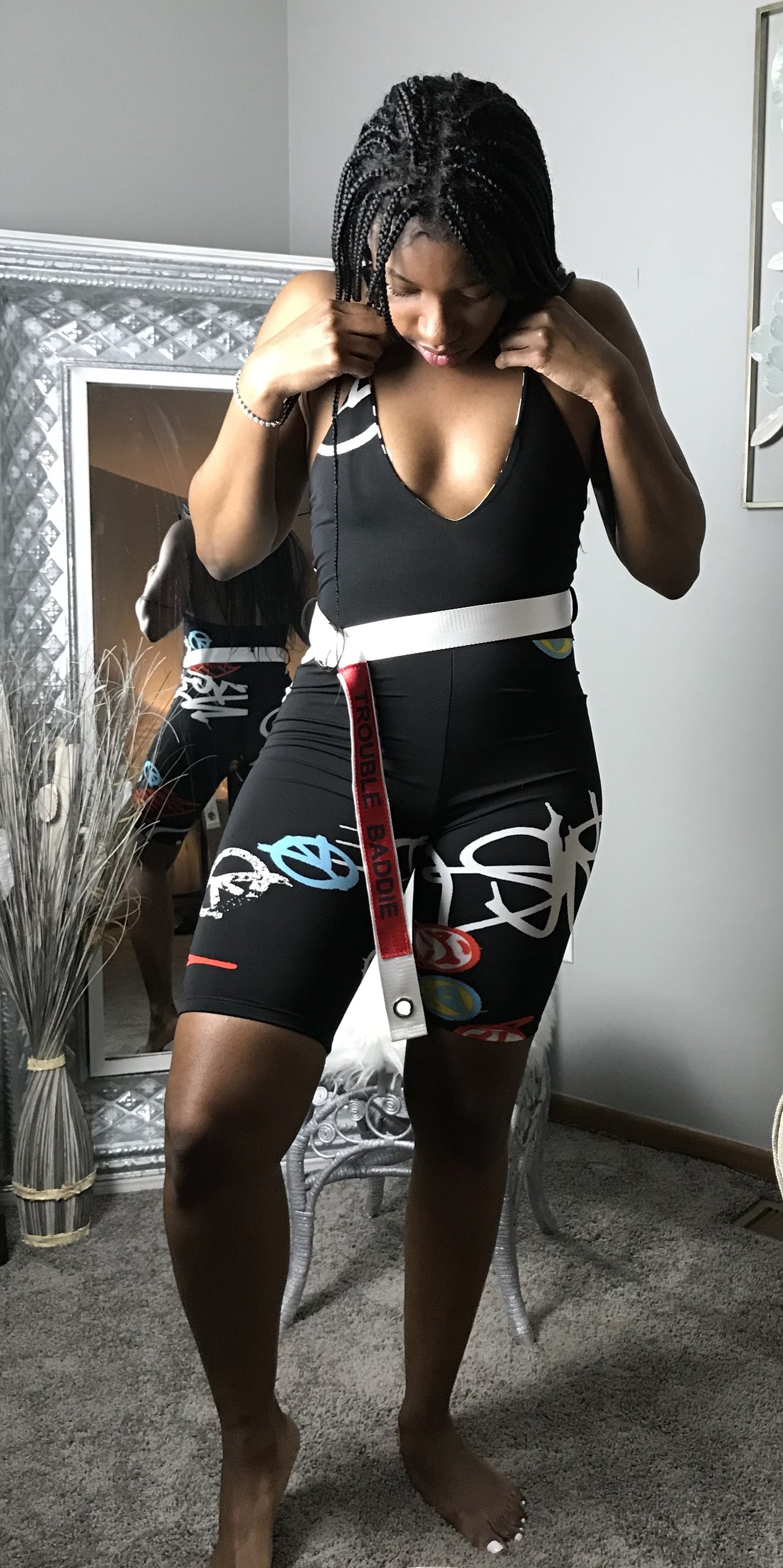 graffiti jumpsuit with trouble belt